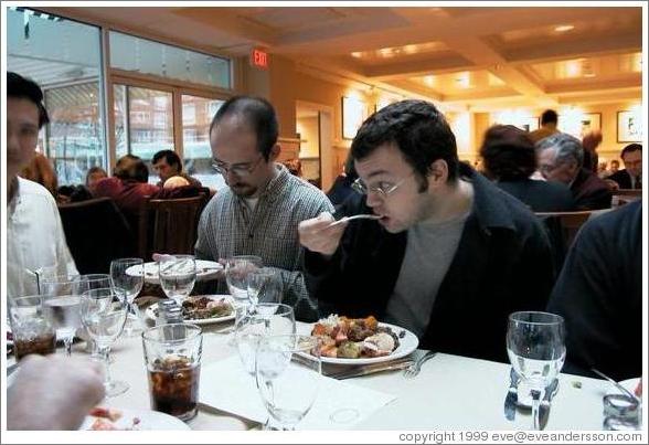 ArsDigita Thanksgiving 1999.  Rolf astounded by Brian's eating habits.