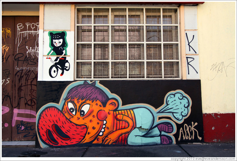 Graffiti: feline woman riding a bicycle and porcine man farting.  Dardignac, Bellavista neighborhood.