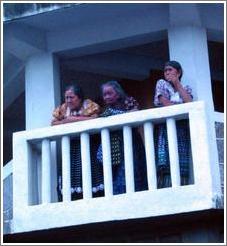 Three women on balcony, San Pedro.
