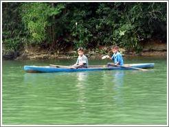 Boys in canoe.