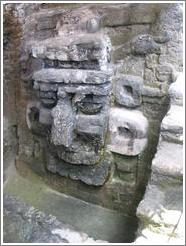 Tikal.  Carved face, North Acropolis.