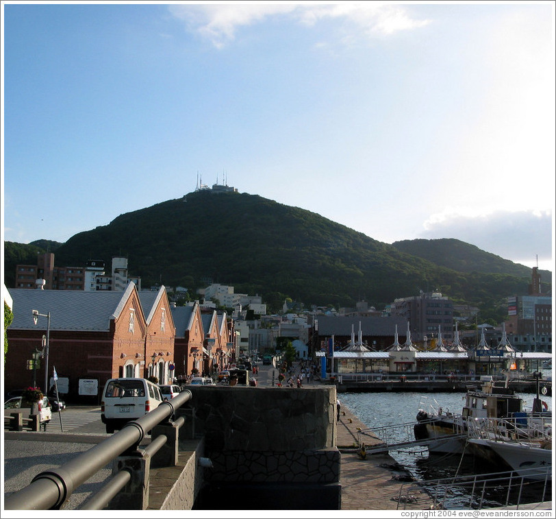 Brick buildings with Mt. Hakodate in background.