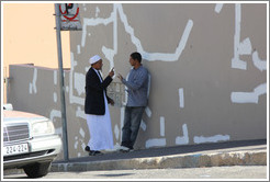 Two men talking. Hout street, Bo-Kaap.