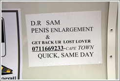Sign in the commuter train advertising same-day penis enlargement by D.r Sam.