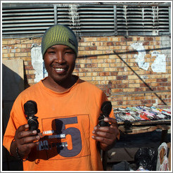 Kip, an excellent artist, with his wares.  Langa township.