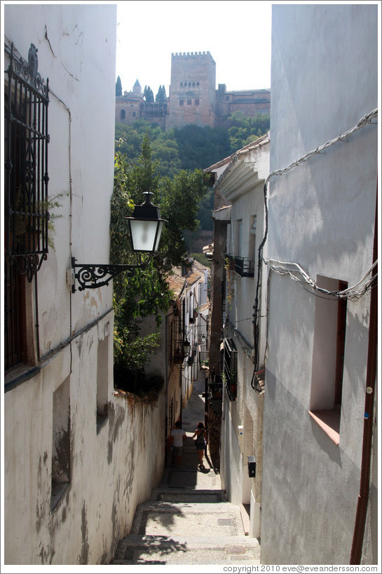 Calle del Candil, Albaic? with the Alhambra in the background.