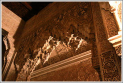 Arch adorned with muqarnas, Patio de los Leones, Nasrid Palace, Alhambra at night.