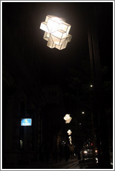 Row of street lights at night.  Calle Gran V?de Col? City center.
