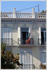 Woman in a red dress on a balcony. Plaza de Bib-Rambla, city center.