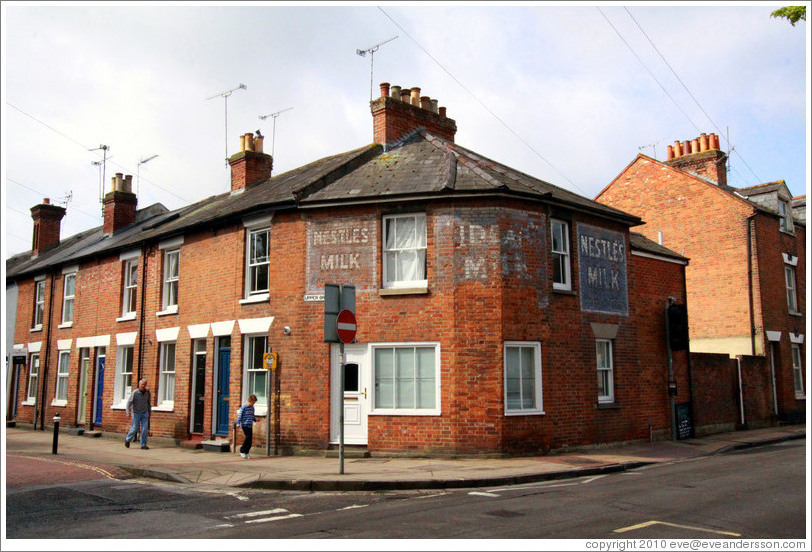 Brick building with old Nestl? Milk signs painted on it.  Corner of Upper Brook St and N Walls St.